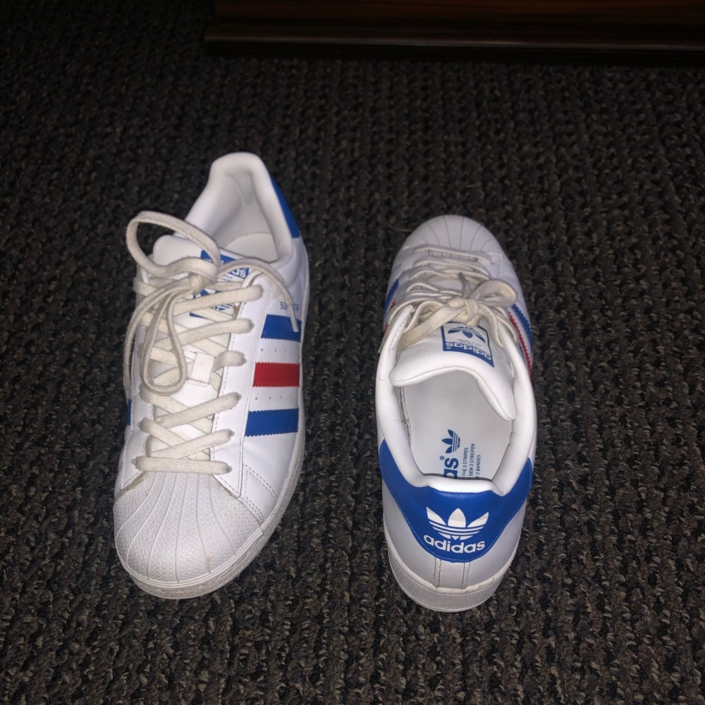 Red and Blue Adidas Superstars